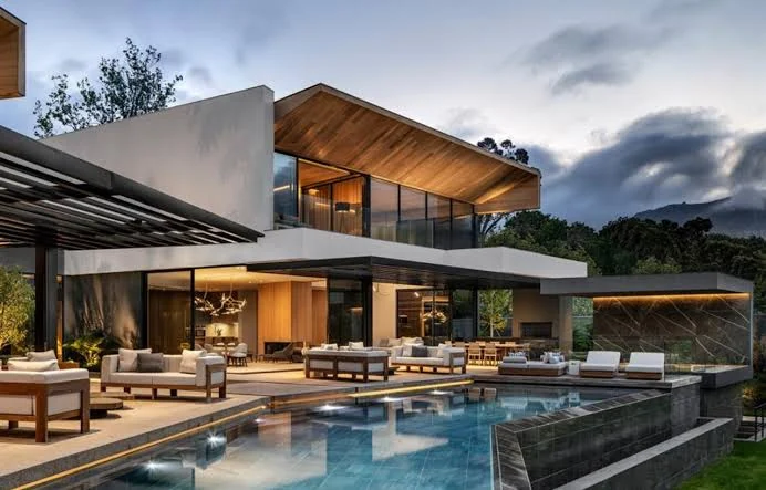 Example farmhouse design with a pool and lounge